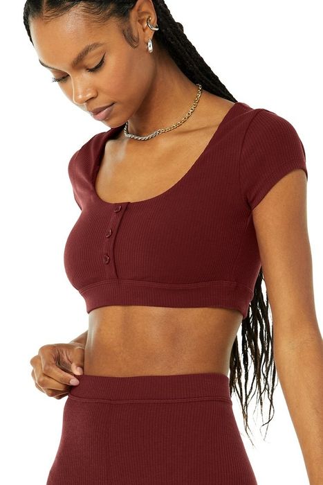 Model wearing the henley bra top in the color 