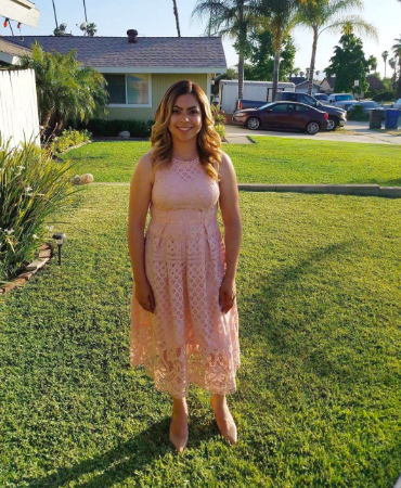 Another reviewer showcasing the dress in a soft light pink hue.