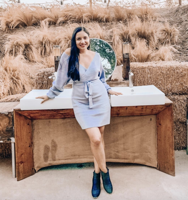 Reviewer rocking a grey off-shoulder dress