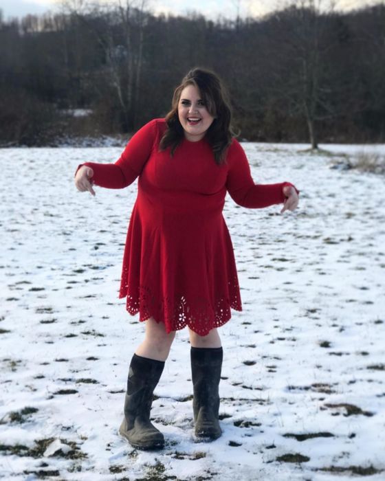 Another reviewer wearing the dress in a vibrant red.