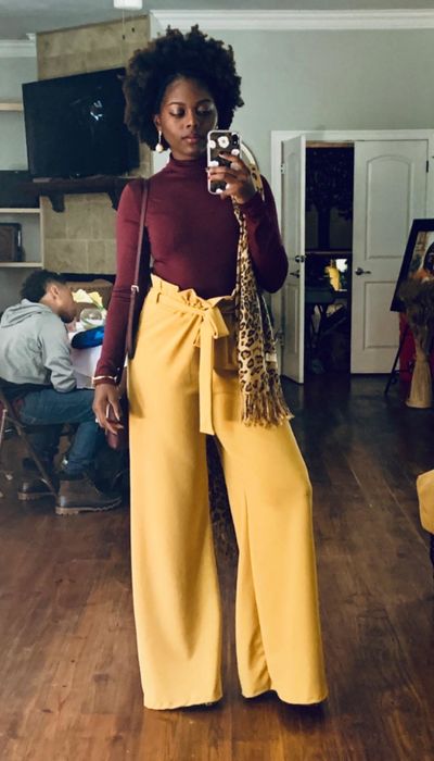 A reviewer shares a mirror selfie wearing yellow pants.