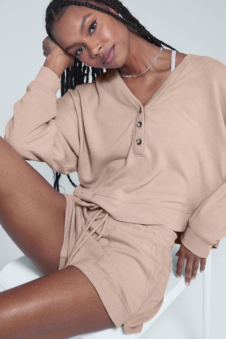 Model wearing the cropped henley in the color 