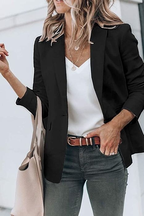 A model rocking the blazer in classic black for a timeless, chic look