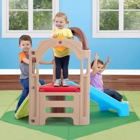 Kids enjoying playtime on a climber