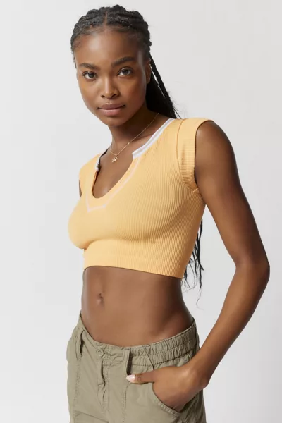 Model showing off the peach-colored tank top