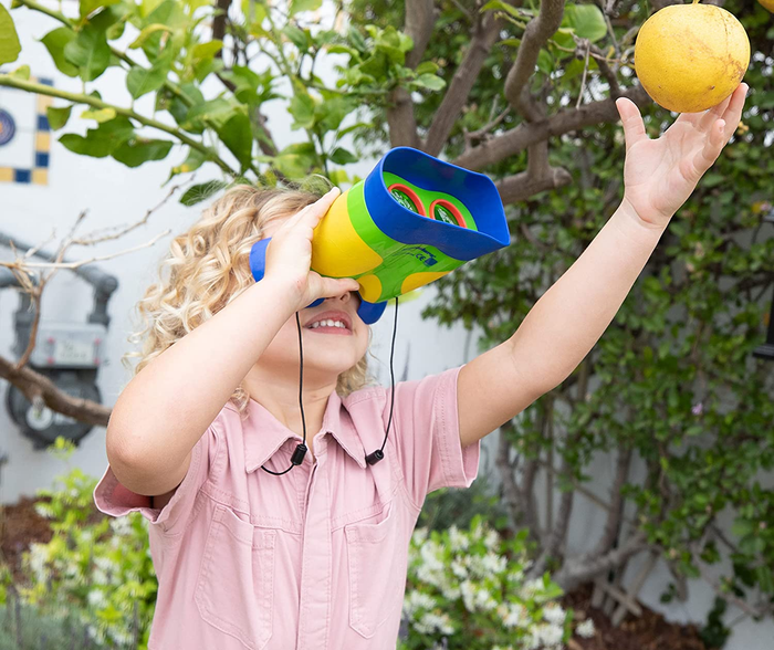 a child using binoculars to explore the surroundings