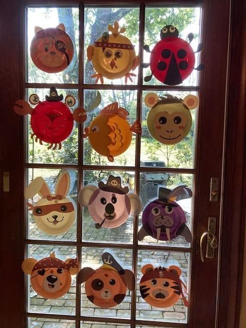 A reviewer's door decorated with colorful paper plate animal creations