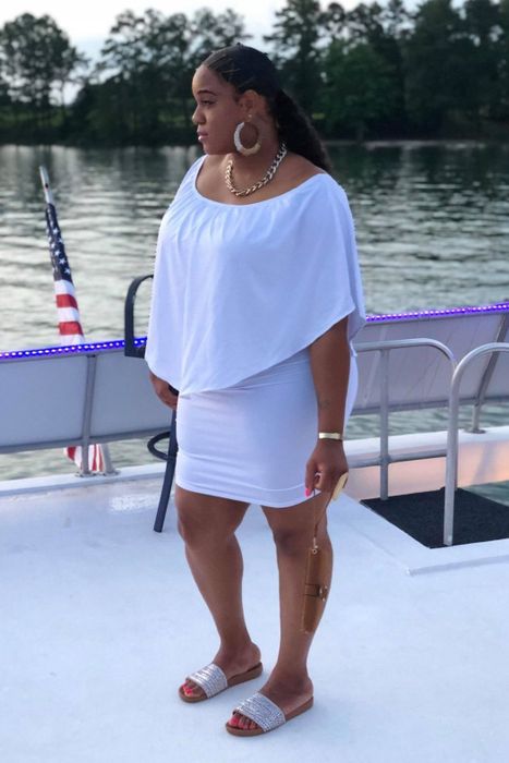 Reviewer in a white dress