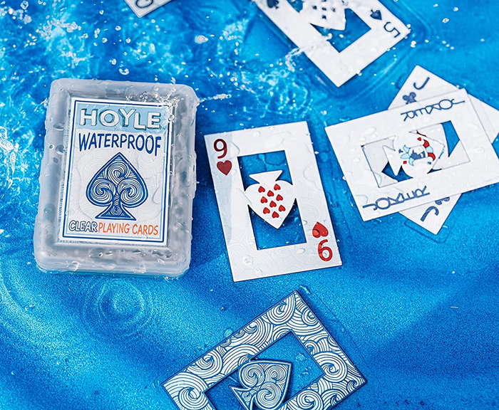 The cards and their case floating in the water