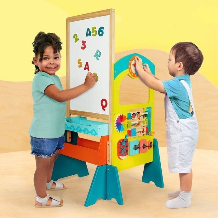Children engage with a learning play set