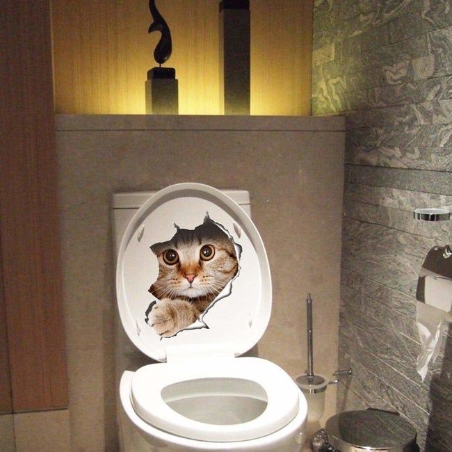 the sticker featuring a large cat appearing to burst through the toilet seat and peek out