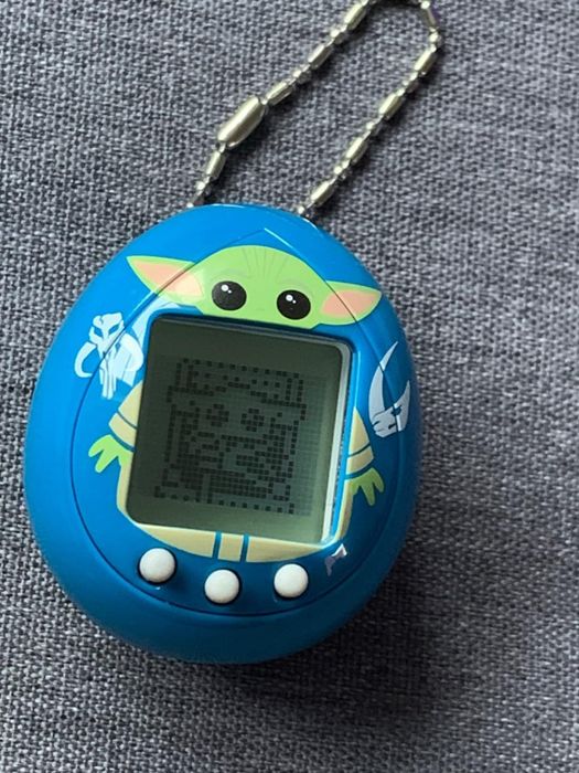 A blue Grogu Tamagotchi