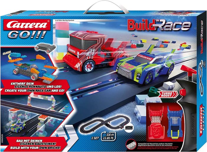The box and contents of the slot car racing set, ready to bring racing action to life.