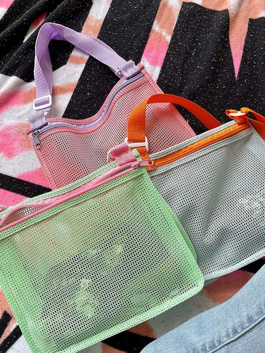 Three mesh bags in soft shades of green, blue, and pink