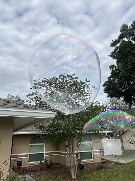Reviewer photo showing two massive bubbles floating outdoors