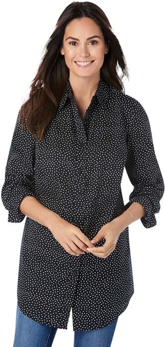 The model is wearing a black button-down shirt with a dotted print.