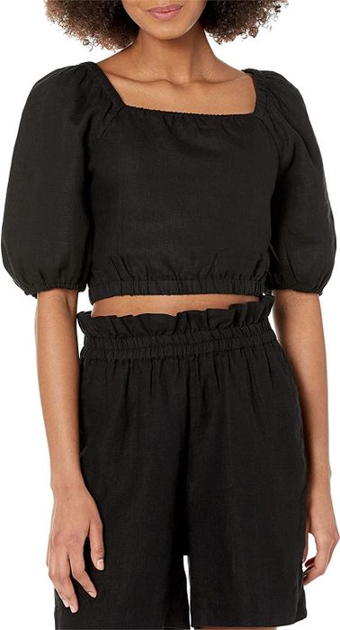 a model wearing the same cropped bubble top in black