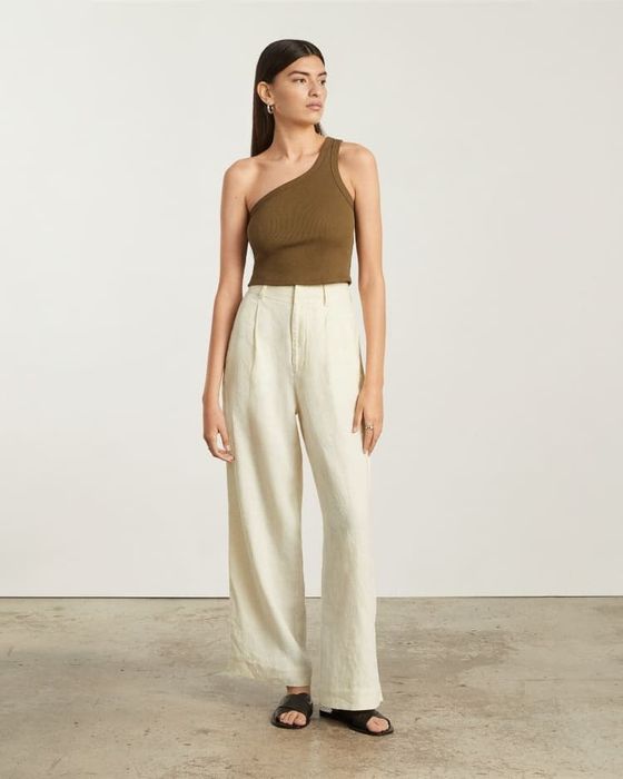 a model wearing linen pants in canvas color