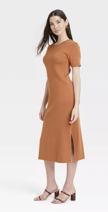 Model wearing the same dress in a warm brown hue