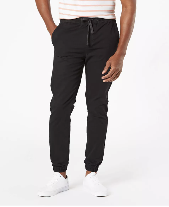 A model is seen wearing joggers in a deep ravenwood black hue.