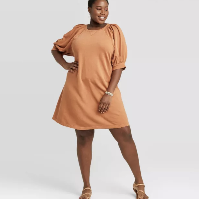 front view of another model wearing the orange version of the dress