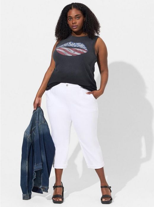 a model showcasing the white cropped vintage jeans