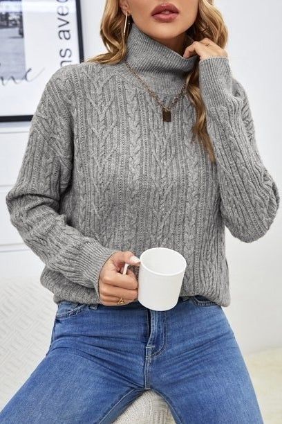 Photo of a model wearing a gray sweater