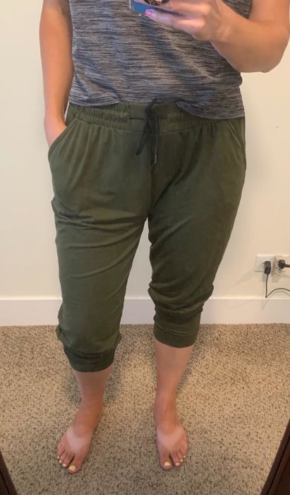 The reviewer is styled in olive Leggings Depot joggers.