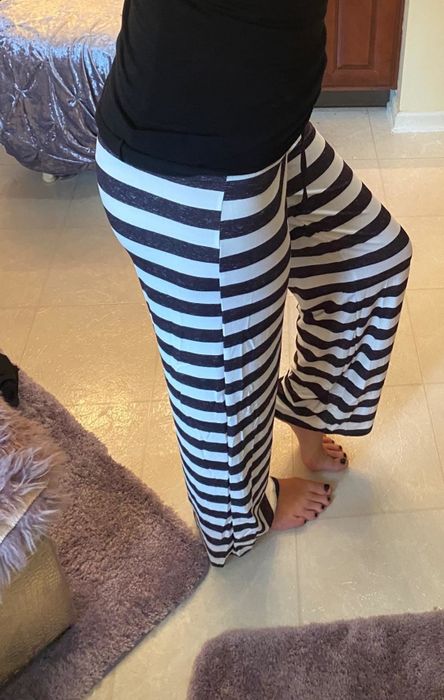 Another Amazon reviewer wearing high-waisted pajama pants.