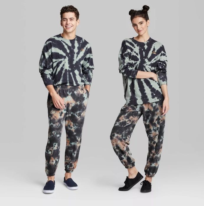 Models showcasing a black and gray tie-dye long sleeve crewneck paired with matching tie-dye pants.