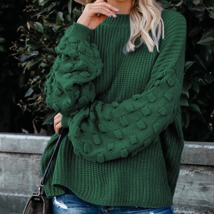 Image of model wearing a green sweater