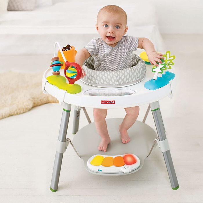 baby sitting inside the activity center