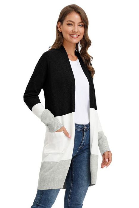 Image of model wearing a black, white, and gray striped cardigan