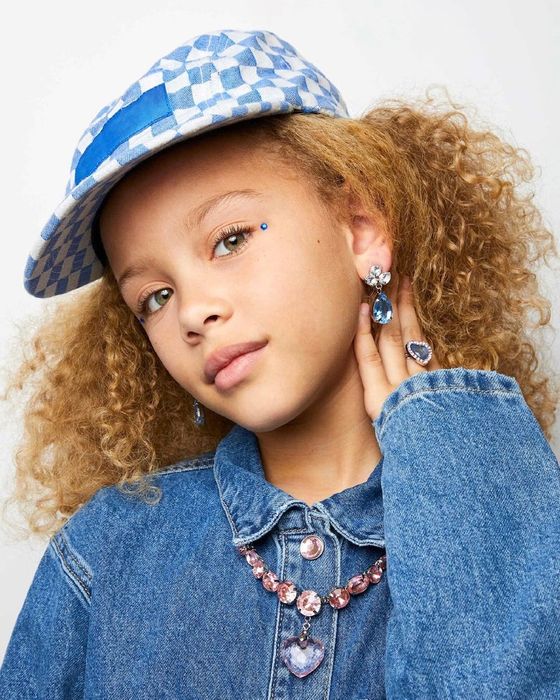 a young model showcasing the jewelry set