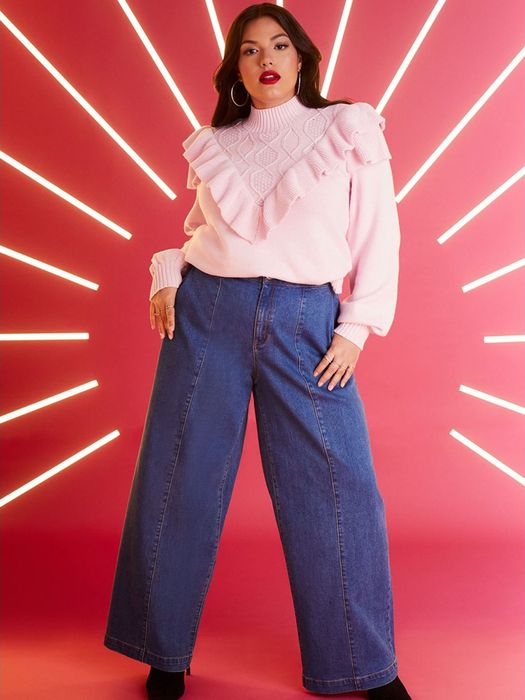 Photo of a model wearing a pink sweater