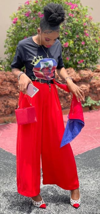 a reviewer rocking red pants