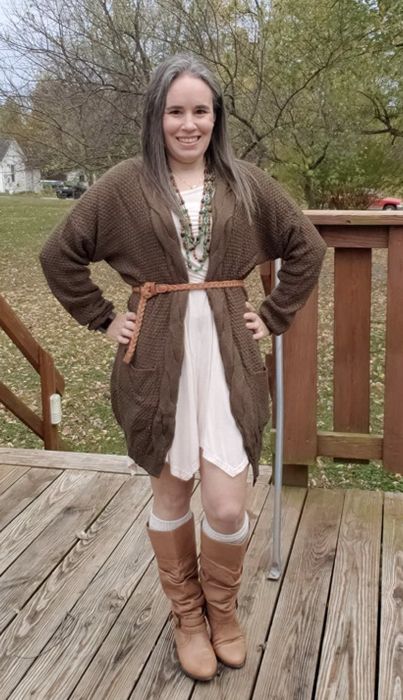 A reviewer wearing the cardigan with a belt.