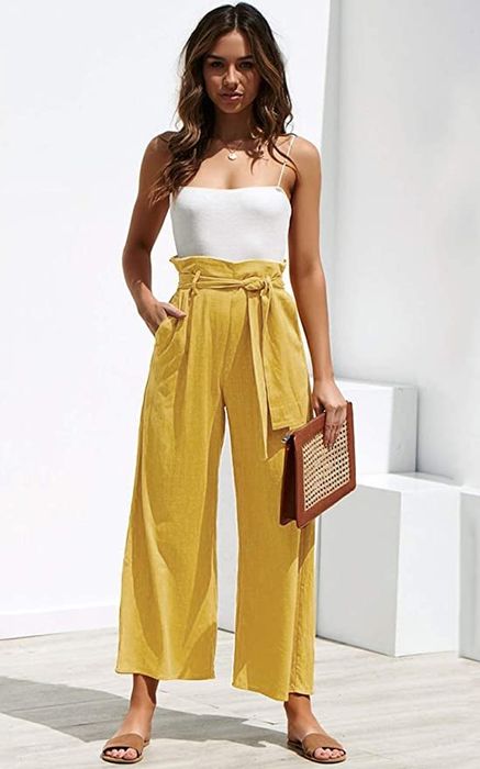 a model wearing yellow pants