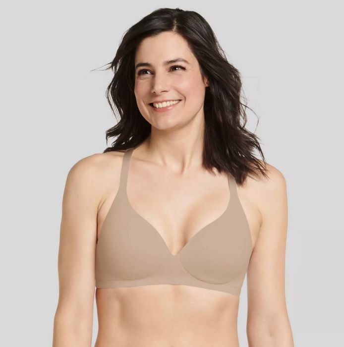 A model showcasing the wireless bra in a soft, light shade.