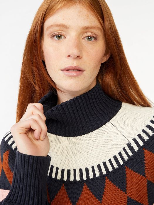 Photo of a model in a navy sweater