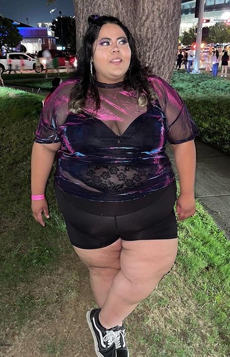 Reviewer wearing the black and pink top