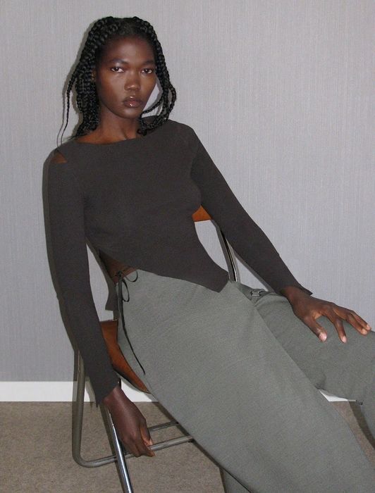 A model in a simple yet stylish sweater.