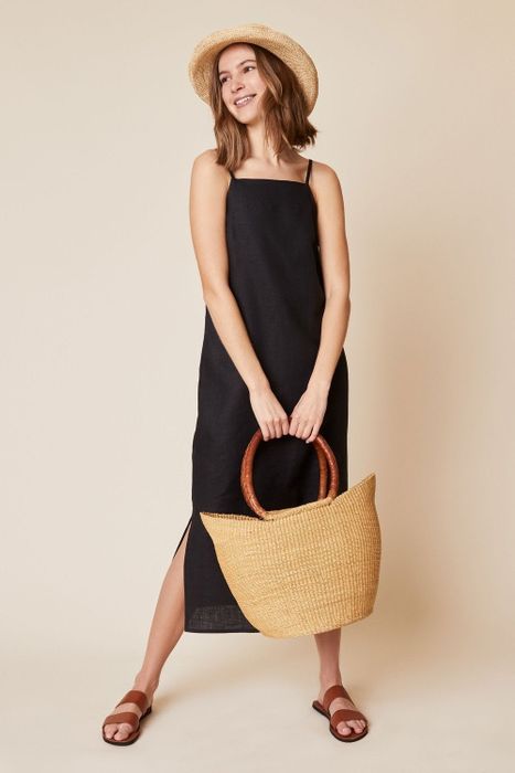 a front view of a model wearing the black version of the dress