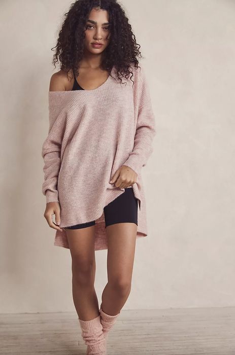 Model wearing a pink oversized sweater