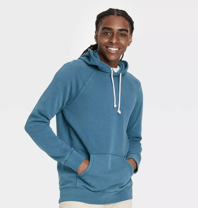 A model sporting the hoodie in dark blue, looking effortlessly stylish.