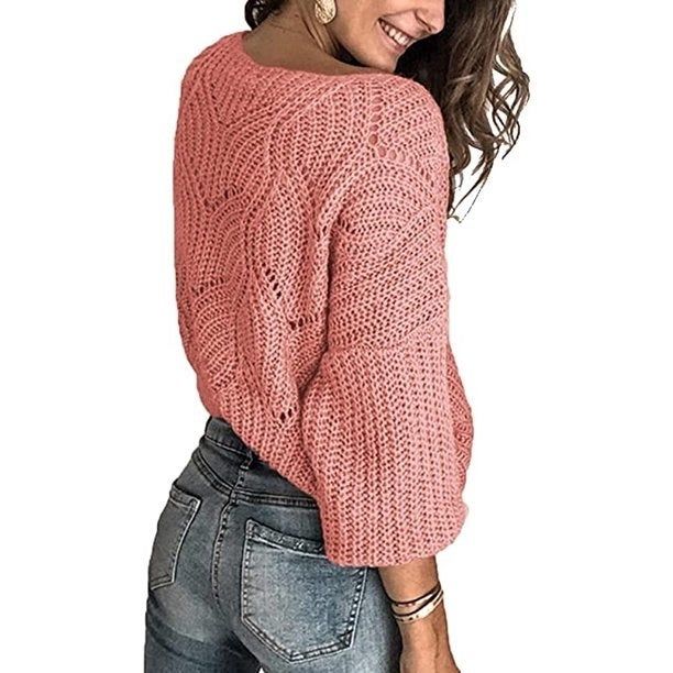 Image of model wearing a pink sweater