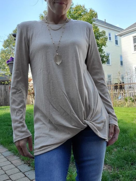 An Amazon reviewer is showing off a khaki twist-knot tunic.