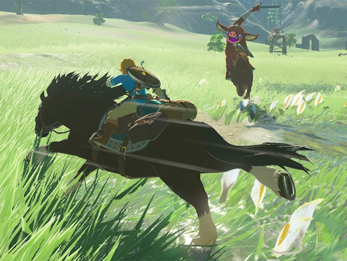 a screenshot of Link riding a horse and battling an enemy in The Legend of Zelda