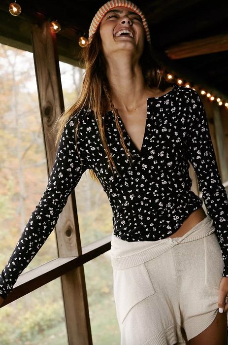 Model wearing a black printed top