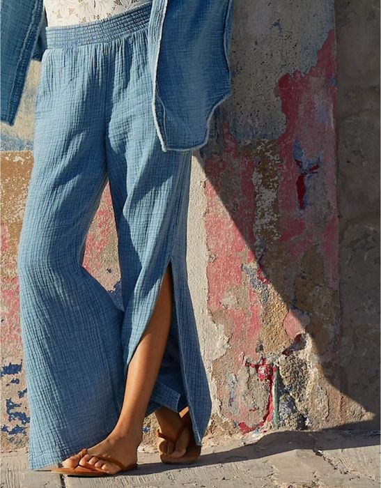 a model wearing blue light wash pool-to-party pants